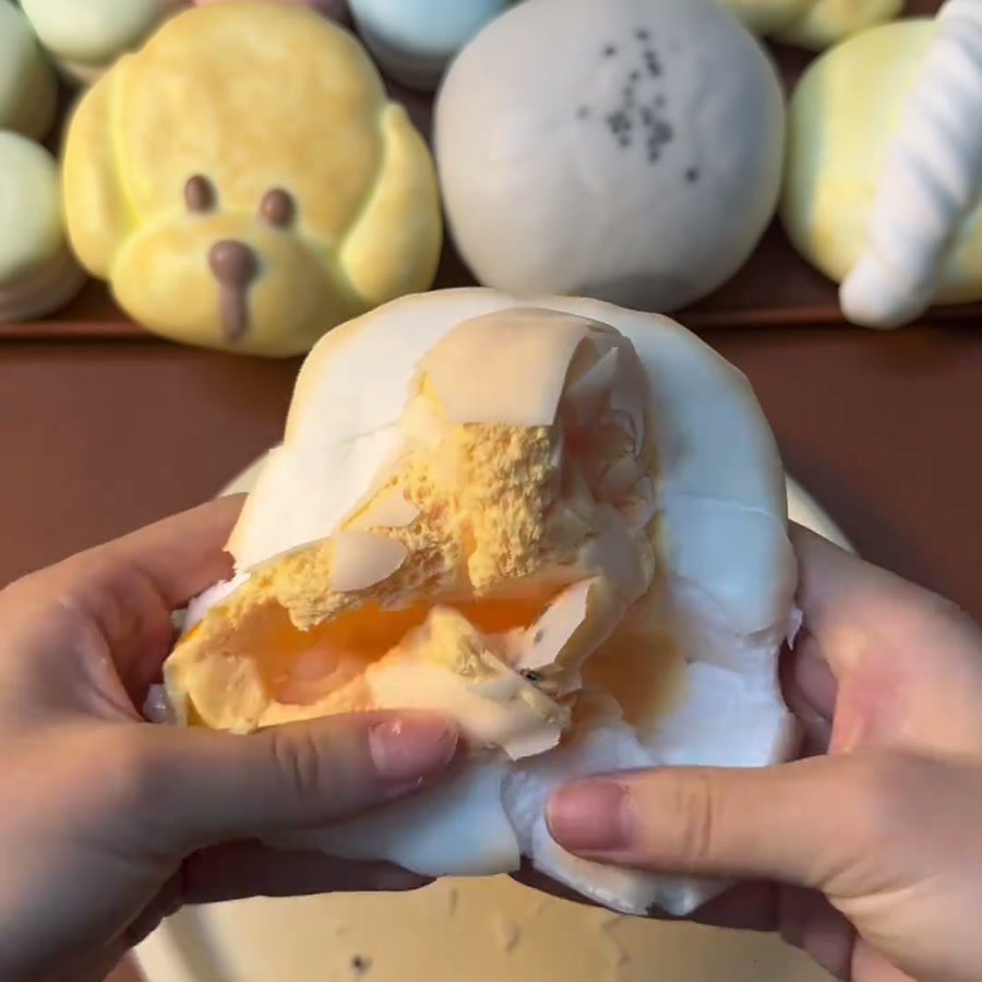Golden Toast Squishy — close-up during pressing