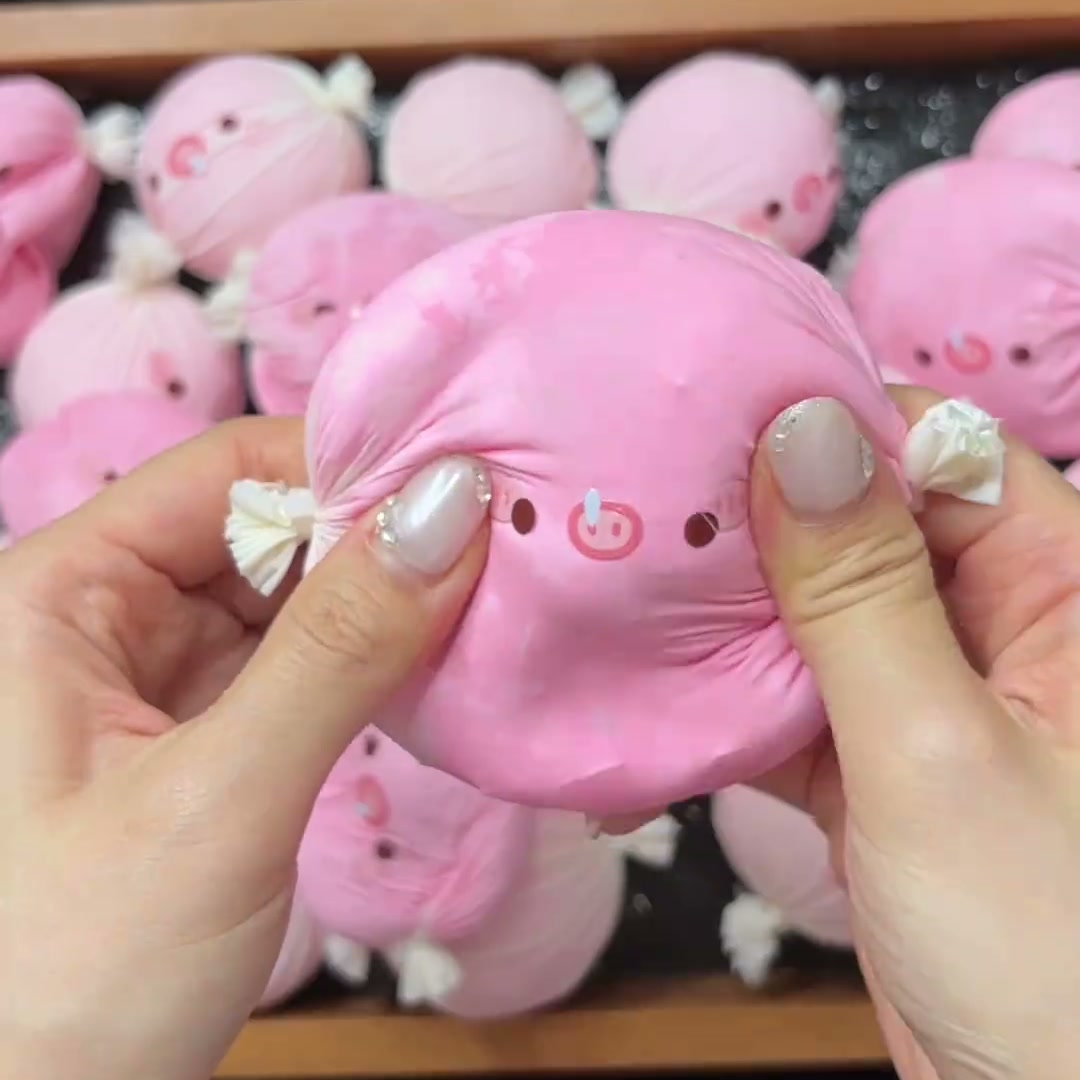 Pressing the pink pig squishy