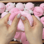 Pink pig candy squishy being squeezed — animated product demonstration